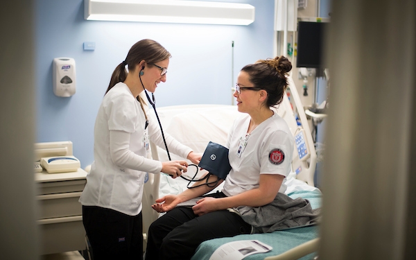 medical professional attending to a patient